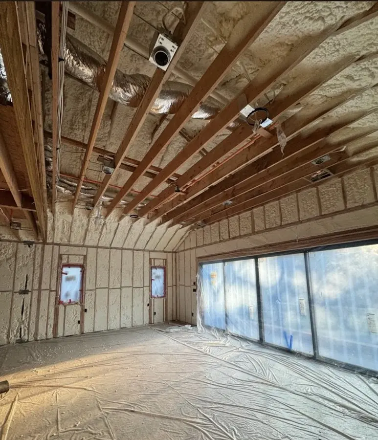 Interior walls and ceiling insulated with spray foam during new construction in San Marcos
